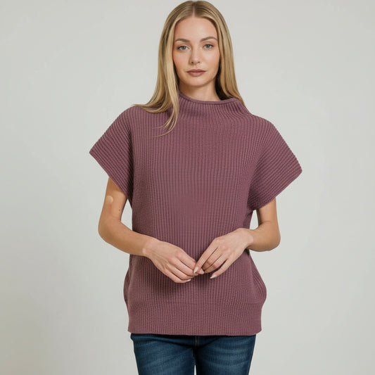Woman wearing a purple ribbed sweater on a white background