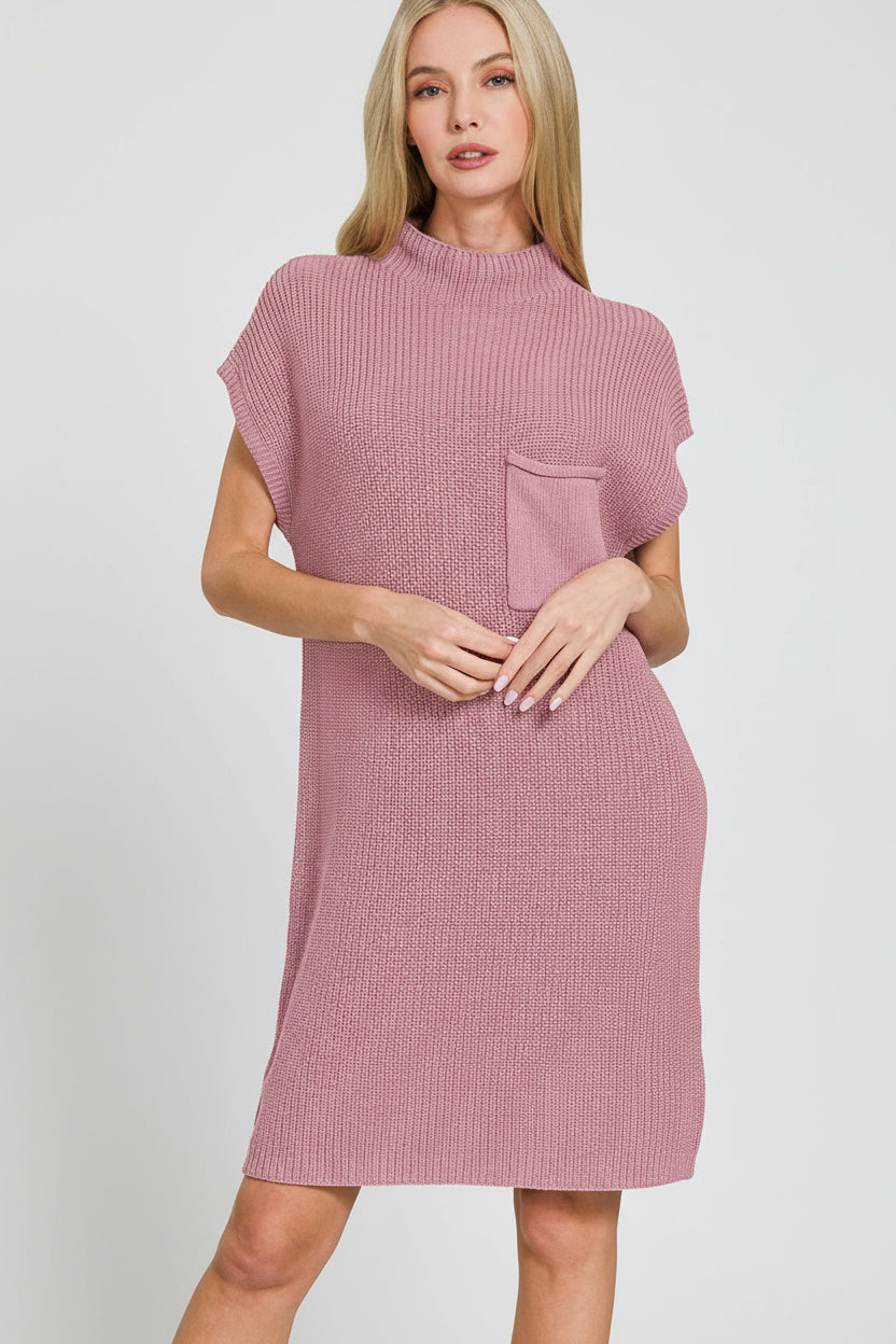 Woman wearing a light rose textured dress on a white background