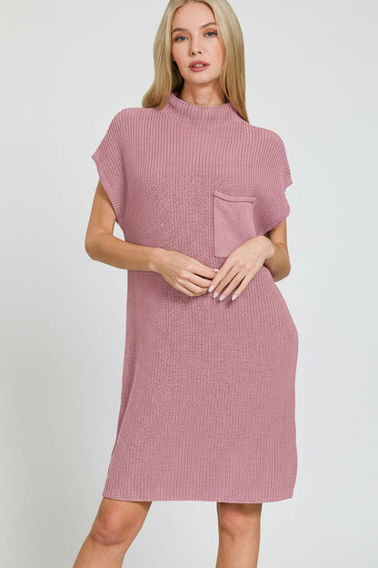 Woman wearing a light rose textured dress on a white background