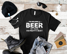 Load image into Gallery viewer, Holding a beer tee
