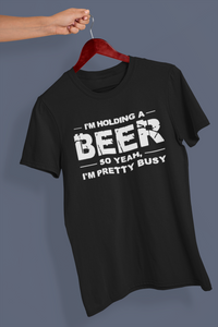 Holding a beer tee